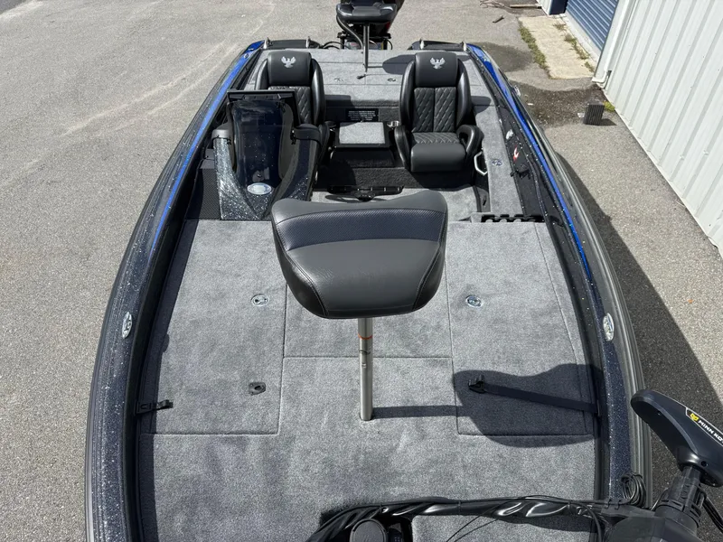 Slide: The Image of 2026 Phoenix 919 ZXL boat interior with gray carpet and black seating. - 5