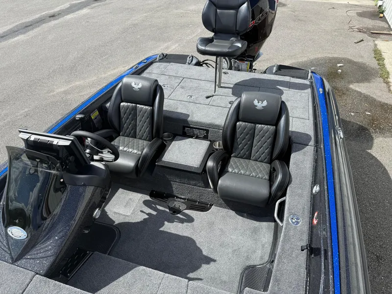 Slide: The Image of 2026 Phoenix 919 ZXL boat interior with black leather seats and steering console. - 8