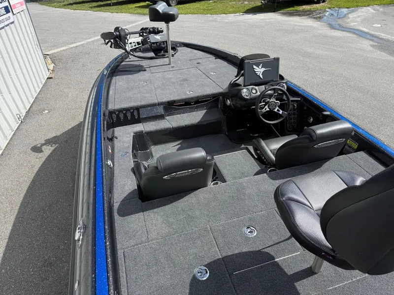 Slide: The Image of 2026 Phoenix 919 ZXL boat interior with dual seats and steering console. - 9