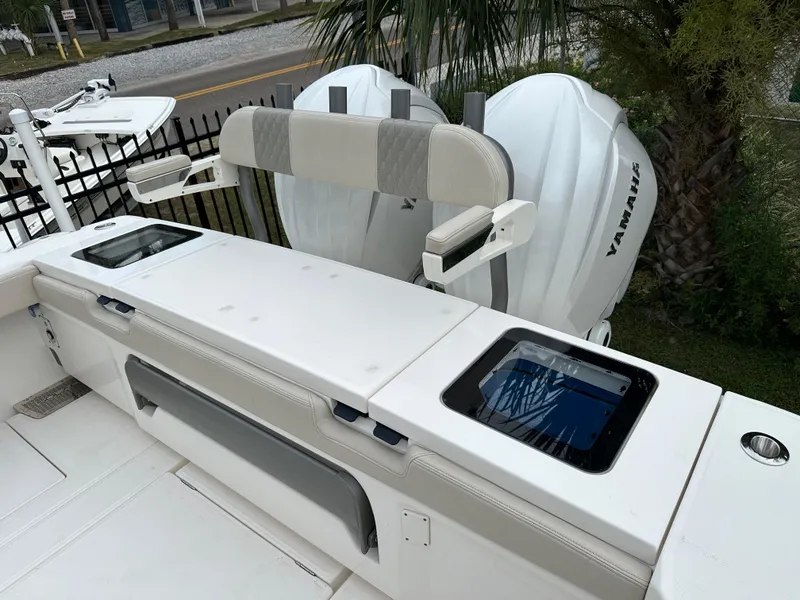 Slide: The Image of Luxurious seating on 2024 Solace 32 CS boat, with scenic water and bridge view. - 11