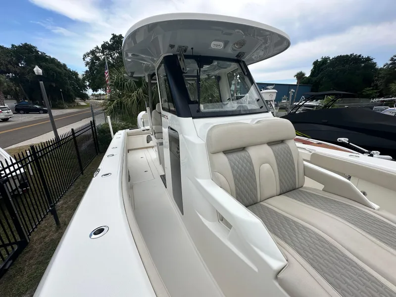 Slide: The Image of 2024 Solace 32 CS cabin interior with sink, toilet, and bed. - 13