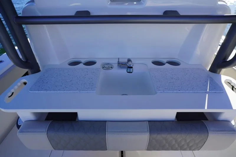 Slide: The Image of 2024 Solace 32 CS boat sink with countertop and cup holders. - 23