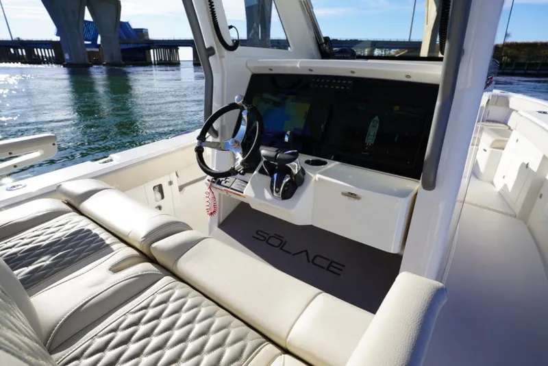Slide: The Image of 2024 Solace 32 CS boat interior with modern helm and luxurious seating. - 27