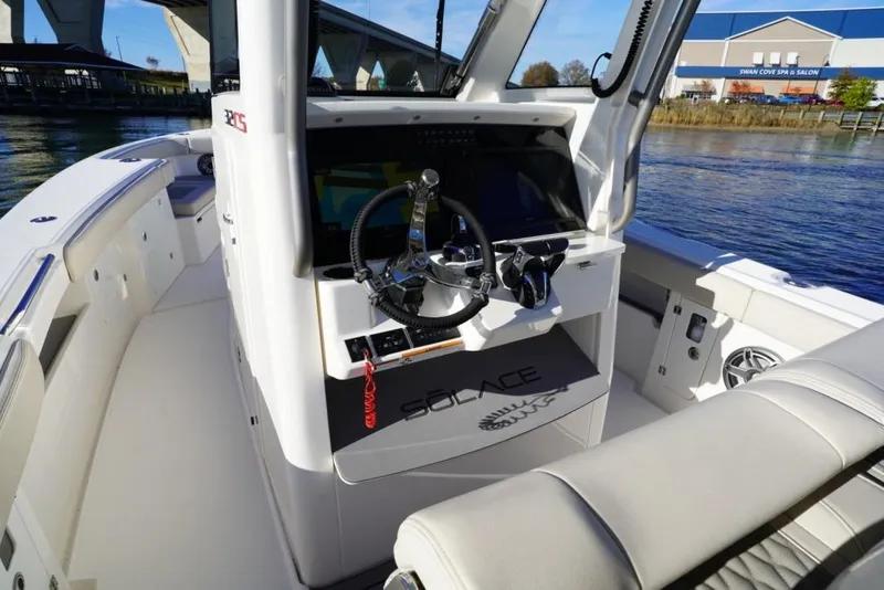 Slide: The Image of 2024 Solace 32 CS boat interior with modern helm and seating. - 29