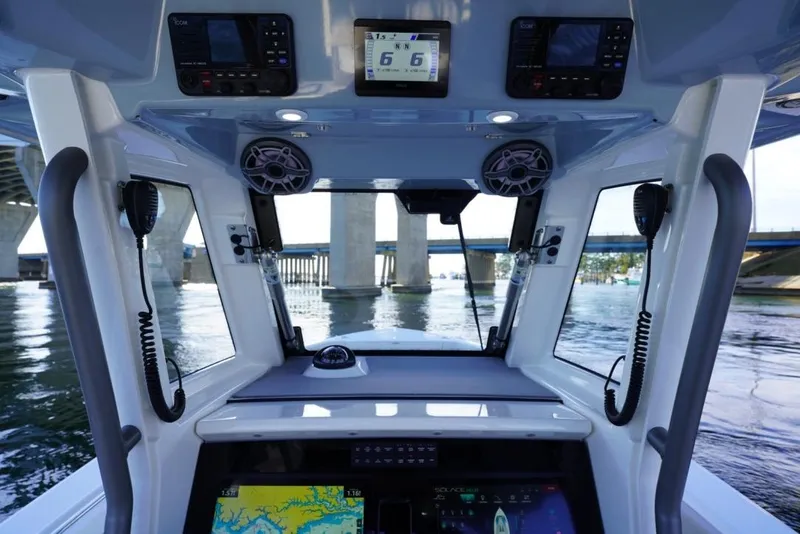 Slide: The Image of 2024 Solace 32 CS boat cockpit with advanced navigation and communication systems. - 33