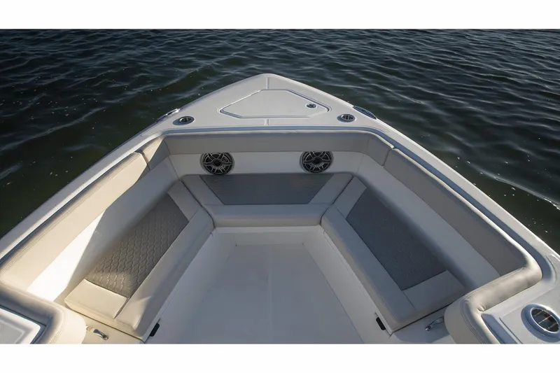Slide: The Image of 2024 Solace 32 CS boat cruising on calm waters. - 4