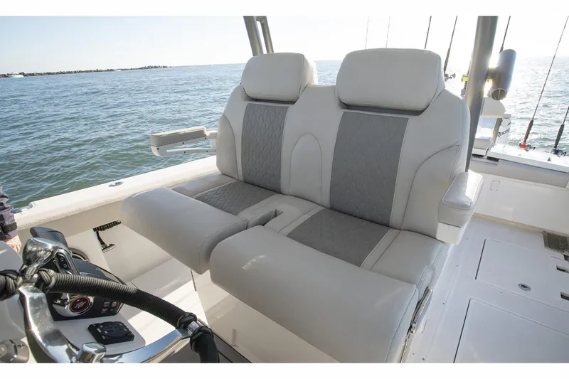Slide: The Image of 2024 Solace 32 CS boat with dual Yamaha 300 V6 outboard engines on water. - 8