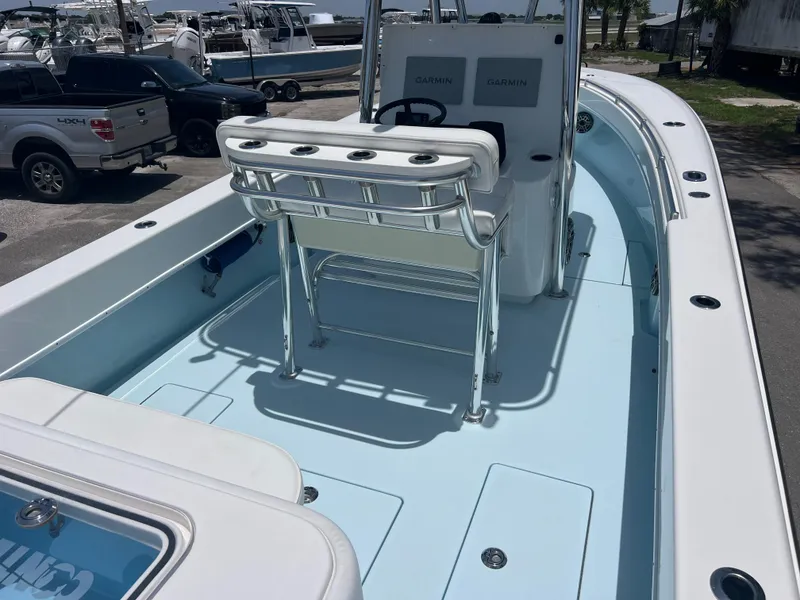 Slide: The Image of 2023 Contender 25 Tournament boat interior with seating and console, showcasing spacious deck design. - 12