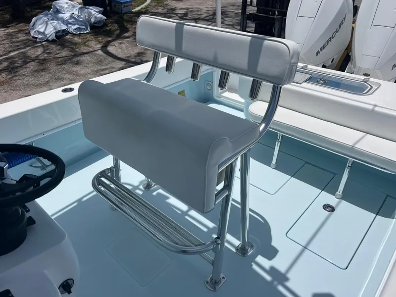 Slide: The Image of 2023 Contender 25 Tournament boat interior with white seating and rod holders. - 14