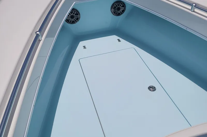 Slide: The Image of 2023 Contender 25 Tournament boat interior with storage compartment and speakers. - 22