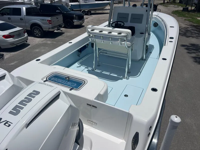Slide: The Image of 2023 Contender 25 Tournament boat with dual engines, spacious deck, and modern console. - 6
