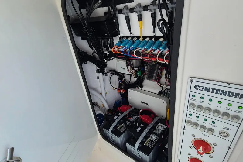 Slide: The Image of 2023 Contender 25 Tournament boat electrical panel and battery compartment. - 8