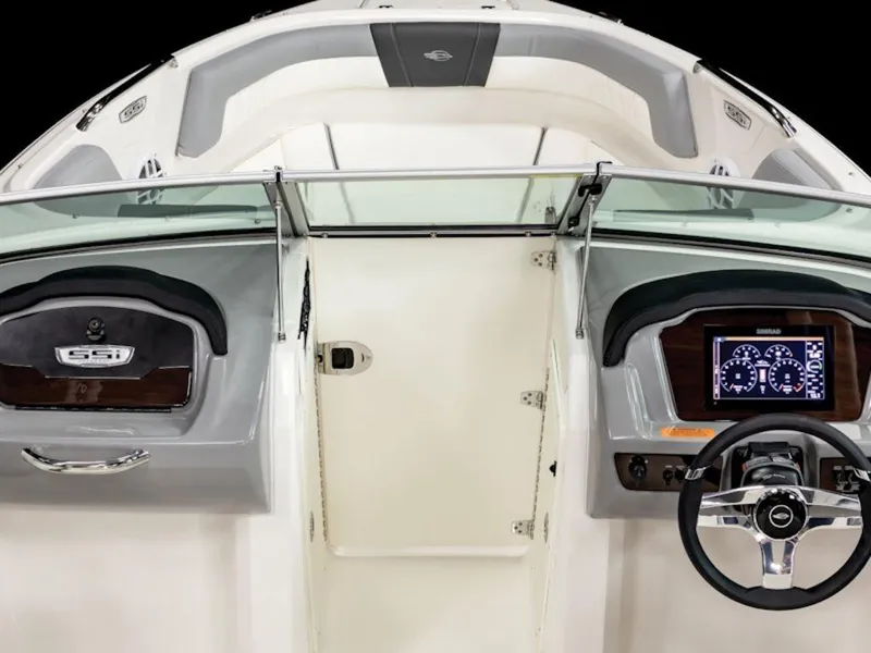 Slide: The Image of 2025 Chaparral 21 SSi OB boat interior with modern dashboard and steering wheel. - 3