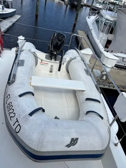 Slide: The Image of Inflatable dinghy on 2014 Beneteau Swift Trawler 44, docked at marina. - 10