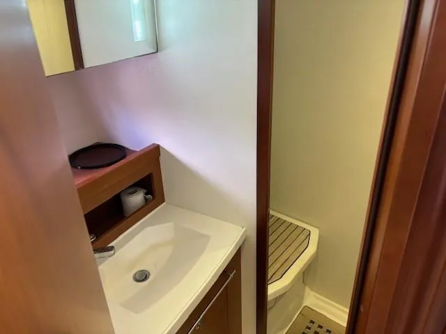 Slide: The Image of Bathroom interior of 2014 Beneteau Swift Trawler 44 with sink and shower area. - 23