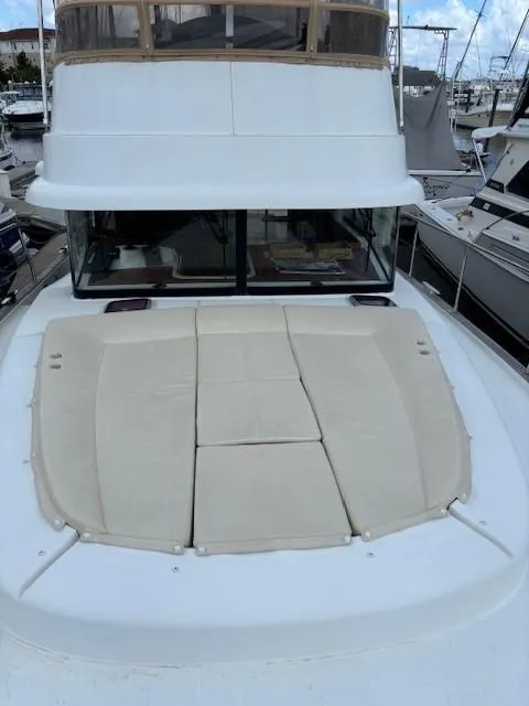 Slide: The Image of 2014 Beneteau Swift Trawler 44 with spacious deck and cushioned seating. - 27