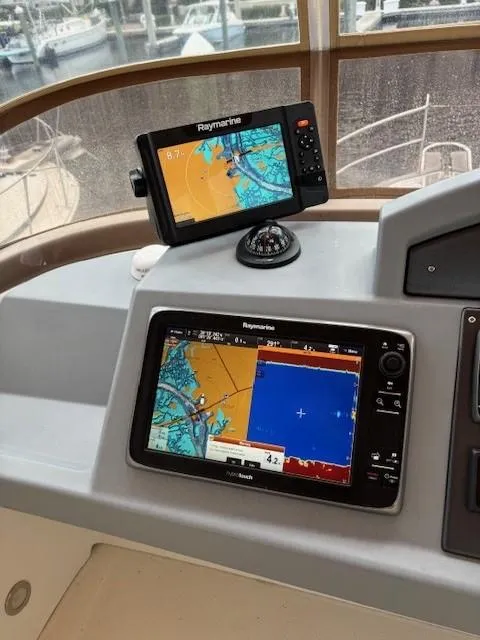Slide: The Image of Navigation equipment on 2014 Beneteau Swift Trawler 44, featuring Raymarine displays. - 8
