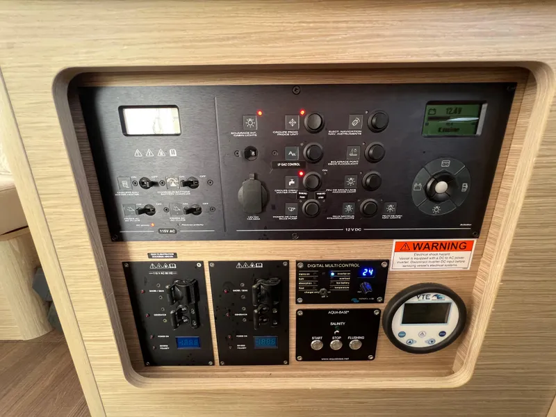 Slide: The Image of Control panel of a 2024 Lagoon 42 yacht, featuring various switches and gauges. - 46