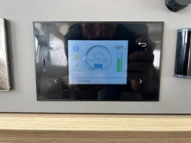 Slide: The Image of Control panel display on 2024 Lagoon 42 showing battery charge status at 66%. - 47