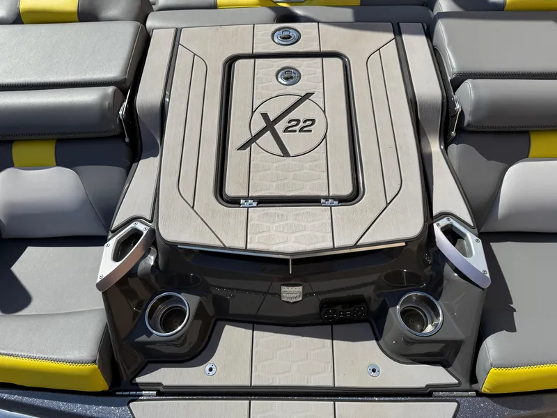 Slide: The Image of 2019 MasterCraft X22 boat deck with cup holders and seating. - 14