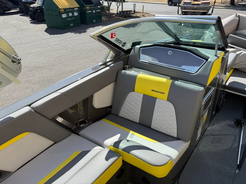 Slide: The Image of 2019 MasterCraft X22 boat interior with gray and yellow seating. - 24