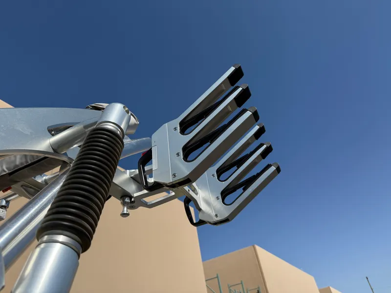 Slide: The Image of 2019 MasterCraft X22 wakeboard rack against clear blue sky. - 33