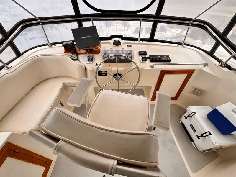 Slide: The Image of Cockpit of 1988 Overseas PT52 Motoryacht with steering wheel and navigation equipment. - 21
