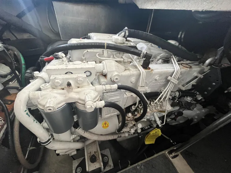 Slide: The Image of Engine compartment of a 2004 Regal Commodore 4260 boat, showcasing mechanical components. - 10
