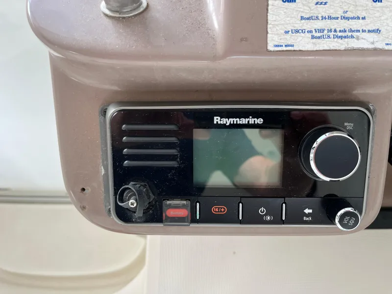 Slide: The Image of Raymarine marine radio on 2004 Regal Commodore 4260 boat dashboard. - 21