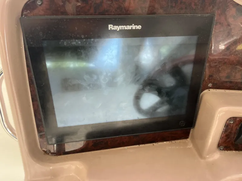 Slide: The Image of Raymarine display on 2004 Regal Commodore 4260 boat dashboard. - 22