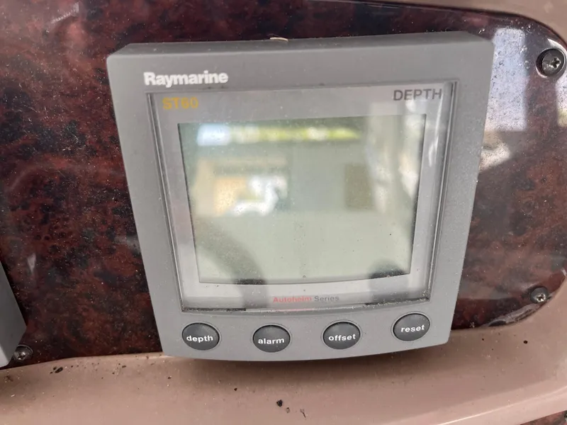 Slide: The Image of Raymarine depth gauge on 2004 Regal Commodore 4260 boat dashboard. - 24