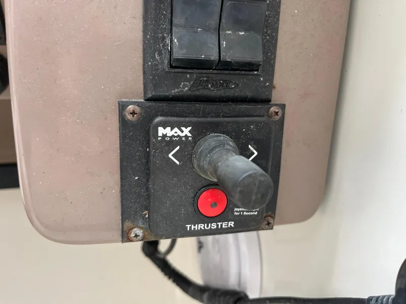 Slide: The Image of Control panel of a 2004 Regal Commodore 4260 boat with thruster joystick. - 25