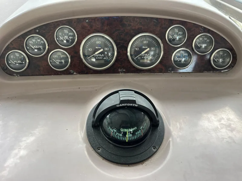 Slide: The Image of Dashboard of 2004 Regal Commodore 4260 with gauges and compass. - 28