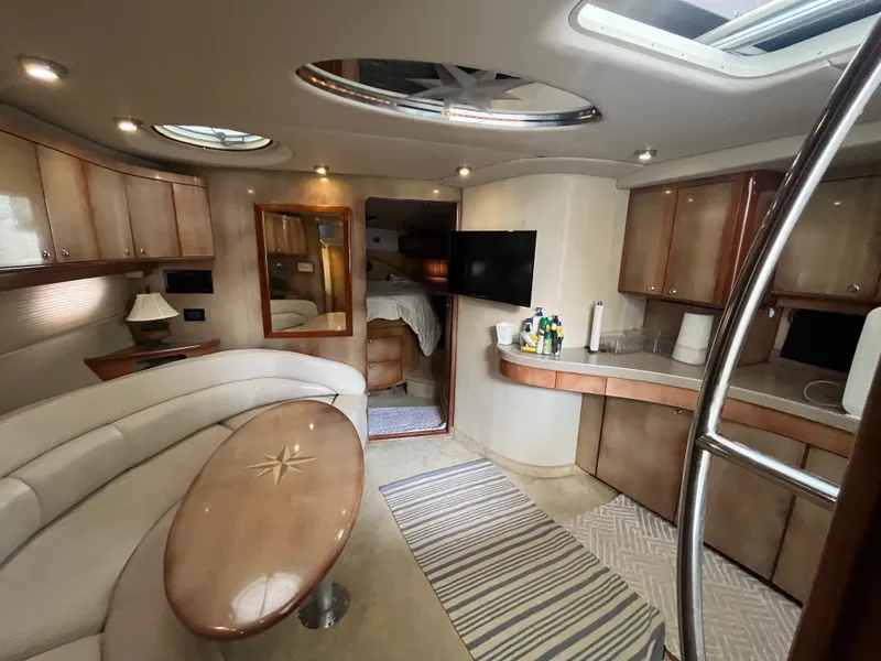 Slide: The Image of Luxurious interior of 2004 Regal Commodore 4260 yacht with modern amenities and elegant design. - 37