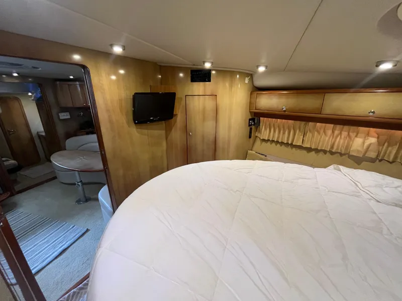Slide: The Image of Luxurious interior of 2004 Regal Commodore 4260 yacht with cozy bedroom and modern amenities. - 41