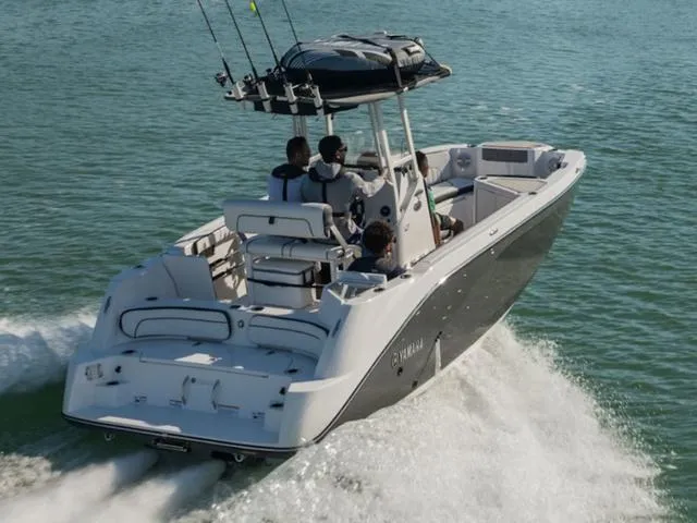 Slide: The Image of 2025 Yamaha Boats 222 FSH Sport cruising on open water, showcasing sleek design and performance. - 3