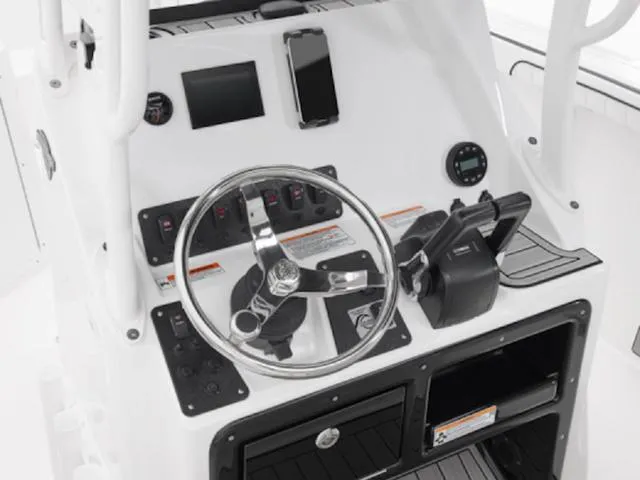 Slide: The Image of Control panel of 2025 Yamaha Boats 222 FSH Sport, featuring steering wheel and electronic displays. - 9