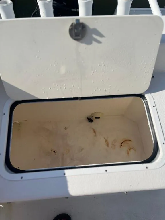 Slide: The Image of Open storage compartment on 2015 AmeraCat 27 boat, showing interior space. - 15