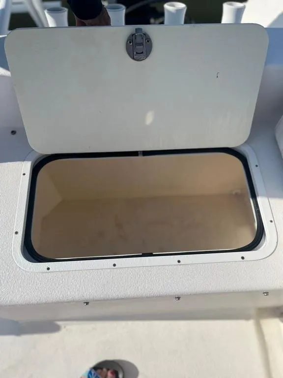 Slide: The Image of Open storage compartment on a 2015 AmeraCat 27 boat. - 16