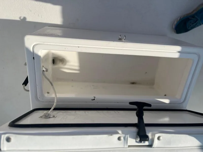 Slide: The Image of Open storage compartment on a 2015 AmeraCat 27 boat. - 21