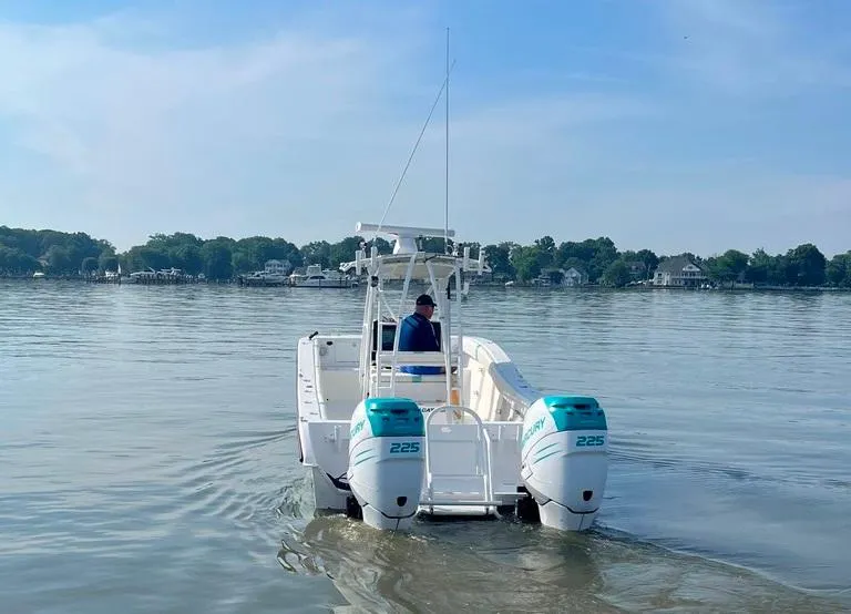 Slide: The Image of 2015 AmeraCat 27 boat with dual 225 engines on a calm lake. - 4