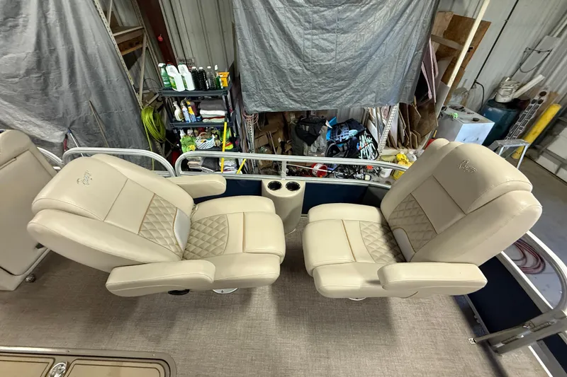 Slide: The Image of Luxurious seating on 2021 Ranger 223FC boat, featuring beige leather and diamond stitching. - 8