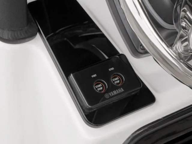 Slide: The Image of 2025 Yamaha Boats 255 FSH Sport E dashboard with start/stop buttons and steering wheel. - 9