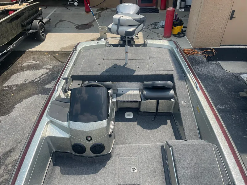 Slide: The Image of 1995 Skeeter ZX 200 boat interior with seating and control console. - 4