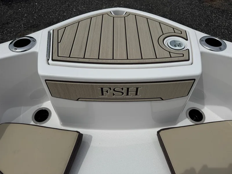 Slide: The Image of 2025 Yamaha Boats 255 FSH Sport E, featuring sleek deck design and cup holders. - 18