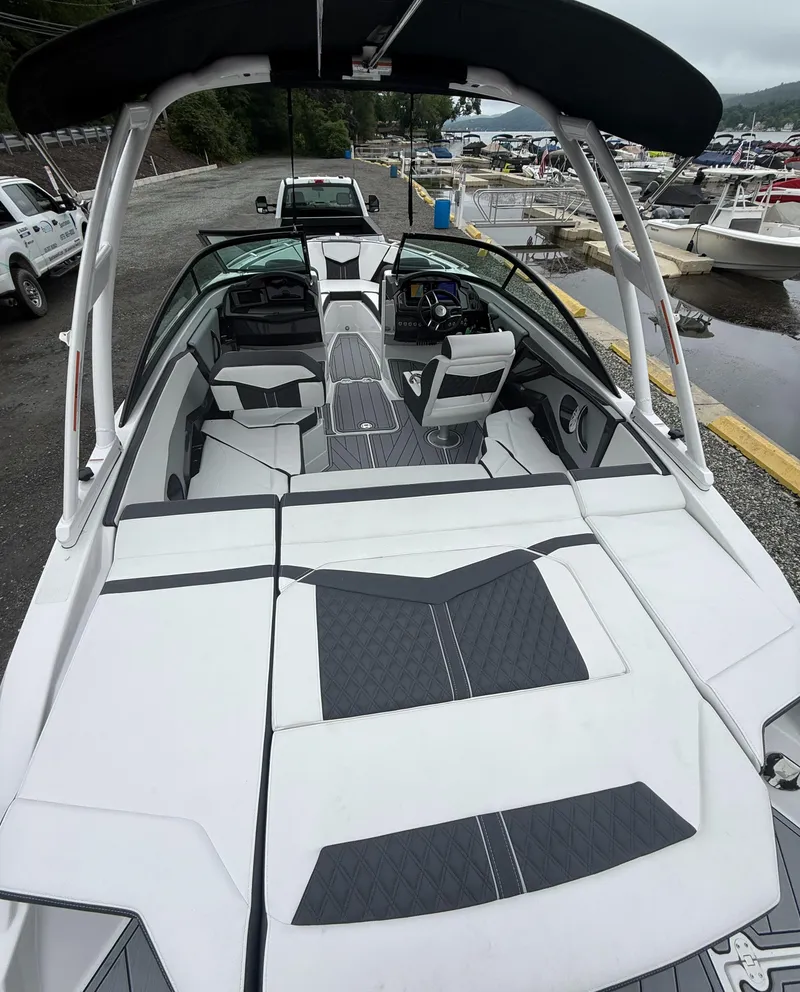 Slide: The Image of 2025 Monterey 238 Super Sport boat with sleek design and spacious seating. - 10