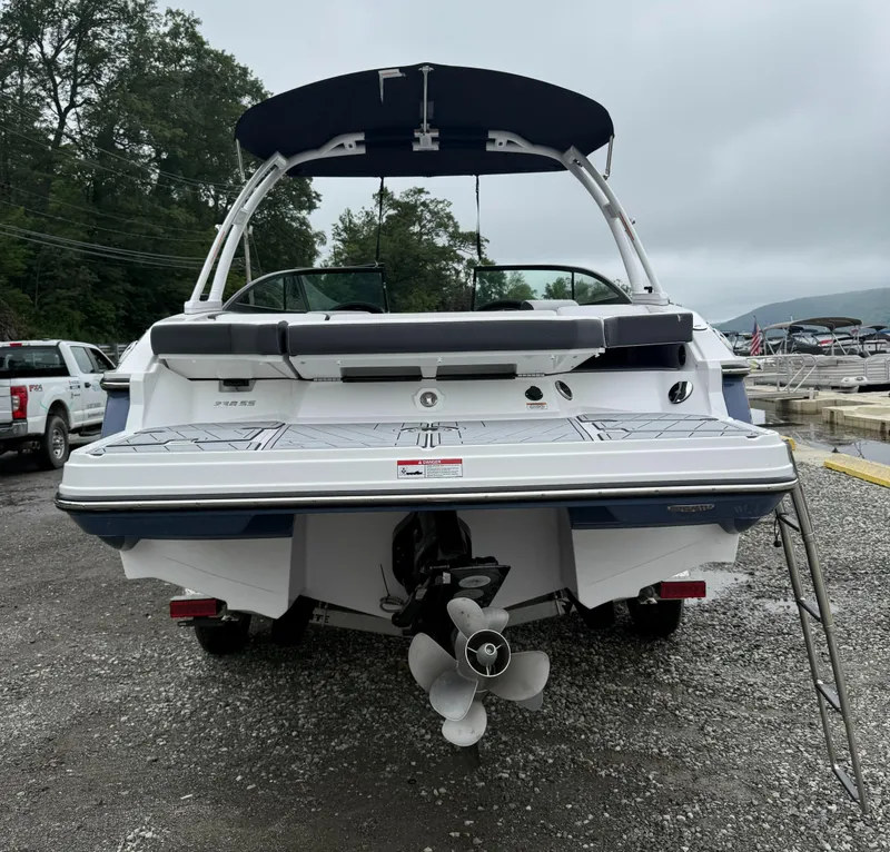 Slide: The Image of 2025 Monterey 238 Super Sport boat, rear view with swim platform and ladder. - 3