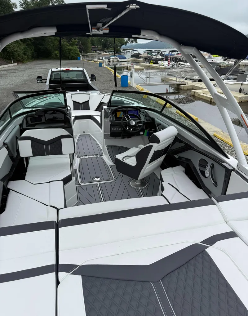 Slide: The Image of 2025 Monterey 238 Super Sport boat with sleek interior design and modern dashboard. - 4