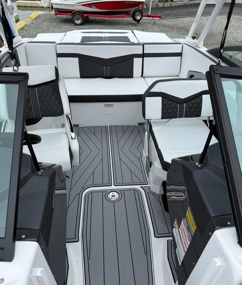 Slide: The Image of 2025 Monterey 238 Super Sport boat interior with sleek seating and modern design. - 5
