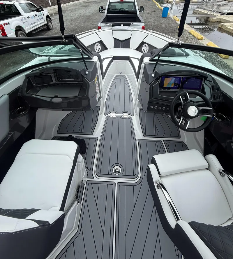 Slide: The Image of 2025 Monterey 238 Super Sport boat interior with sleek design and modern dashboard. - 7